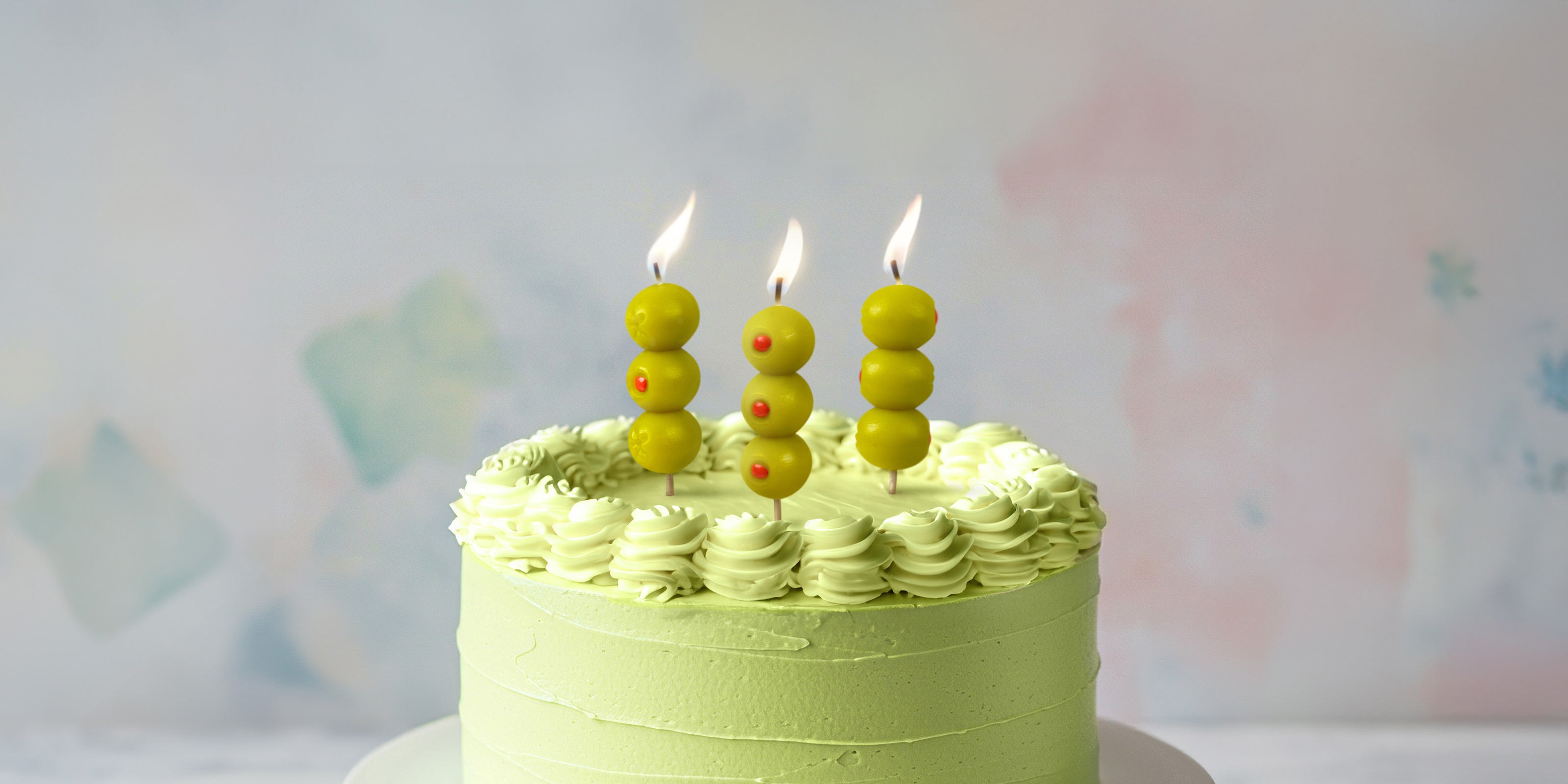 "Funny birthday candles including Pasta Party, LIT joint candles, and Blow Me balloon candles displayed with party cake setting"