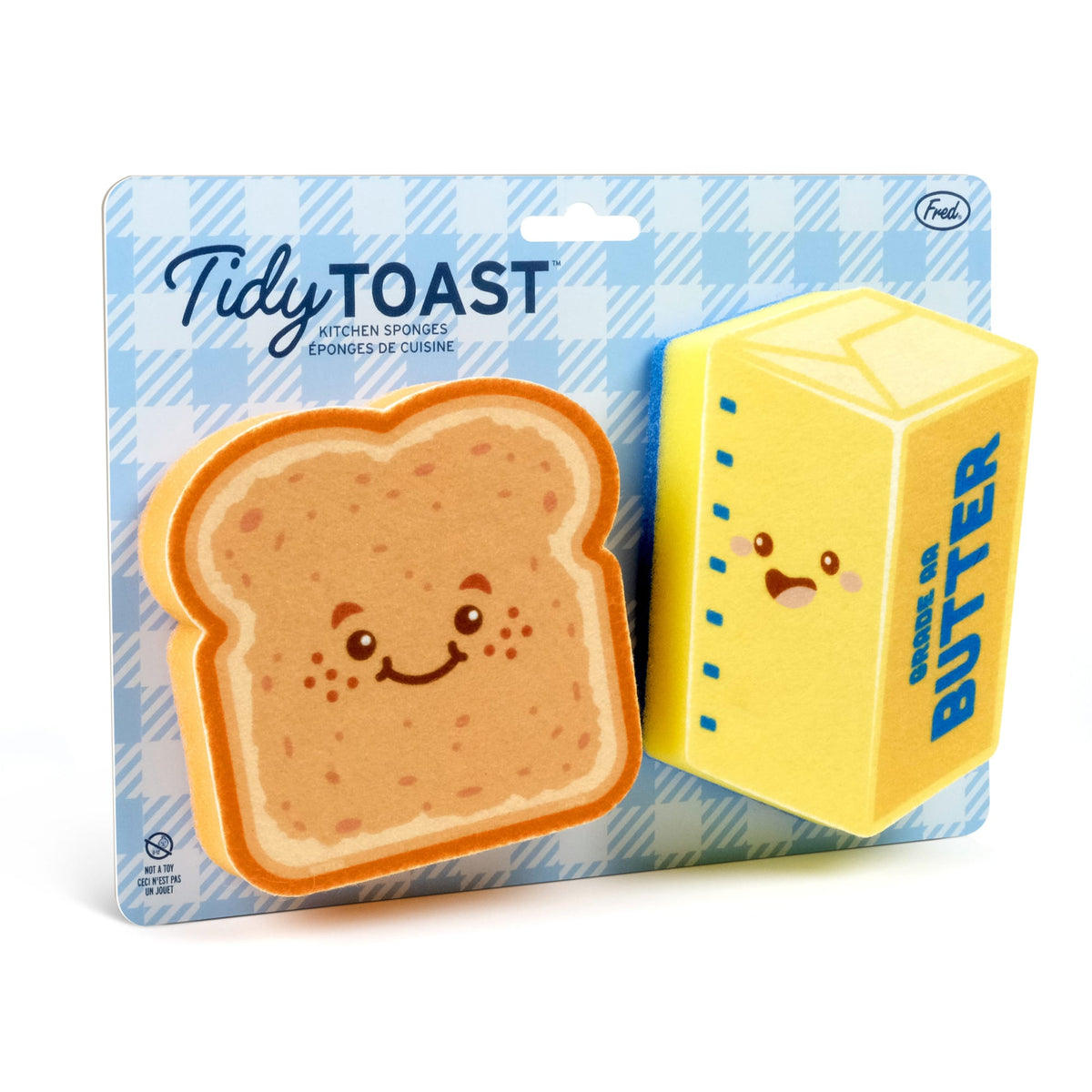 Tidy Toast packaging with a wooden spoon resting on an open notebook beside the sponge