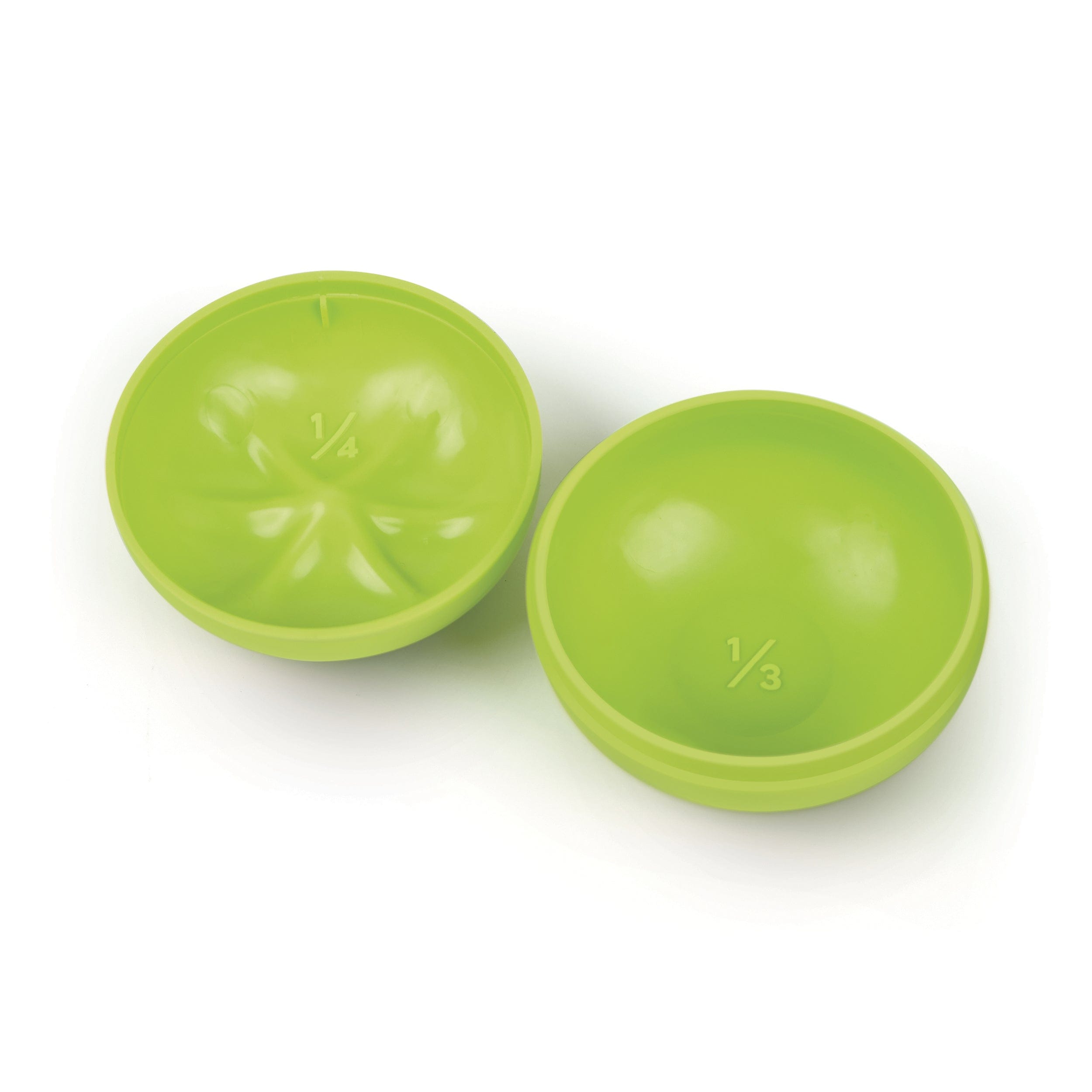 Interior of two green tomato measuring cups on a white background