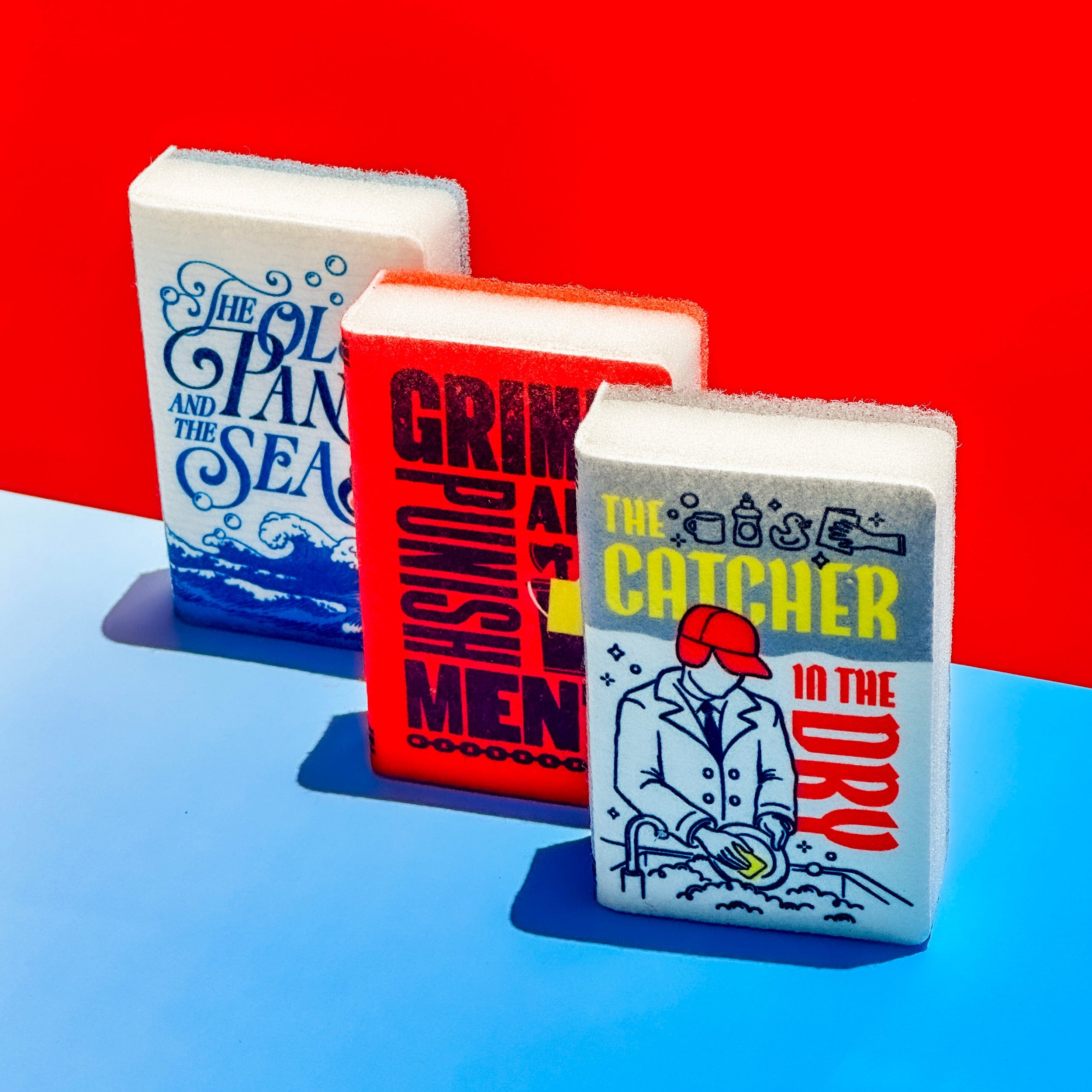 Three book-shaped sponges with book covers on a red and blue gradient background
