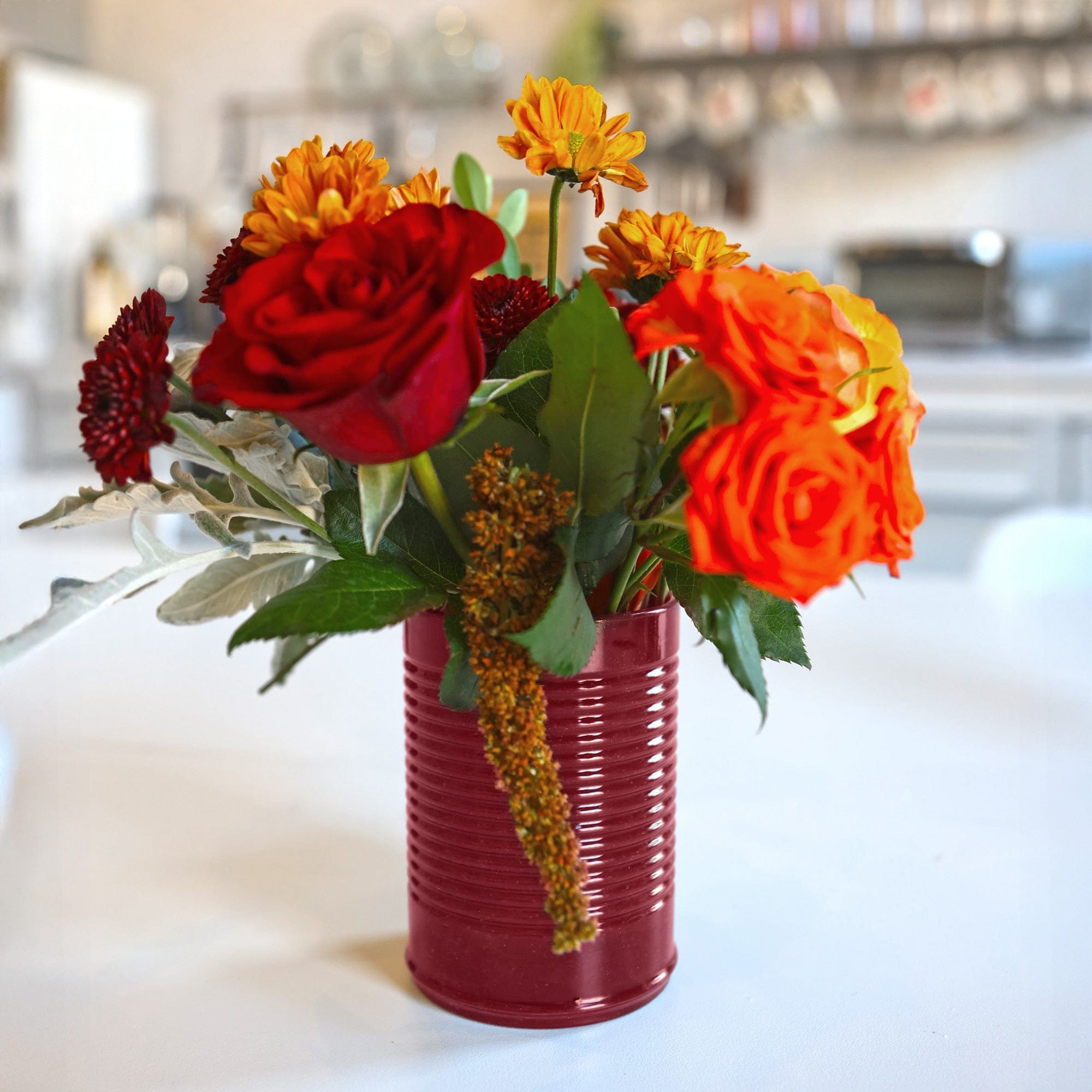 Cranberry sauce–themed silicone cup on a holiday table — playful drinkware for Secret Santa or host gifting.
