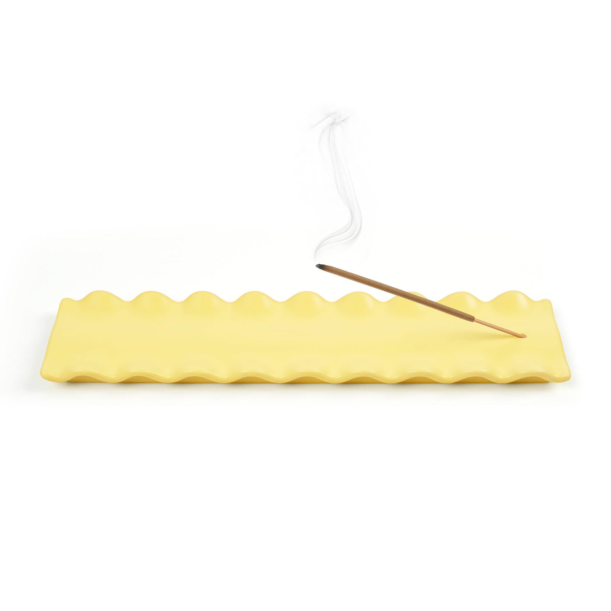 Carb Appeal incense holder with a lit incense stick above a yellow wavy tray on a white background