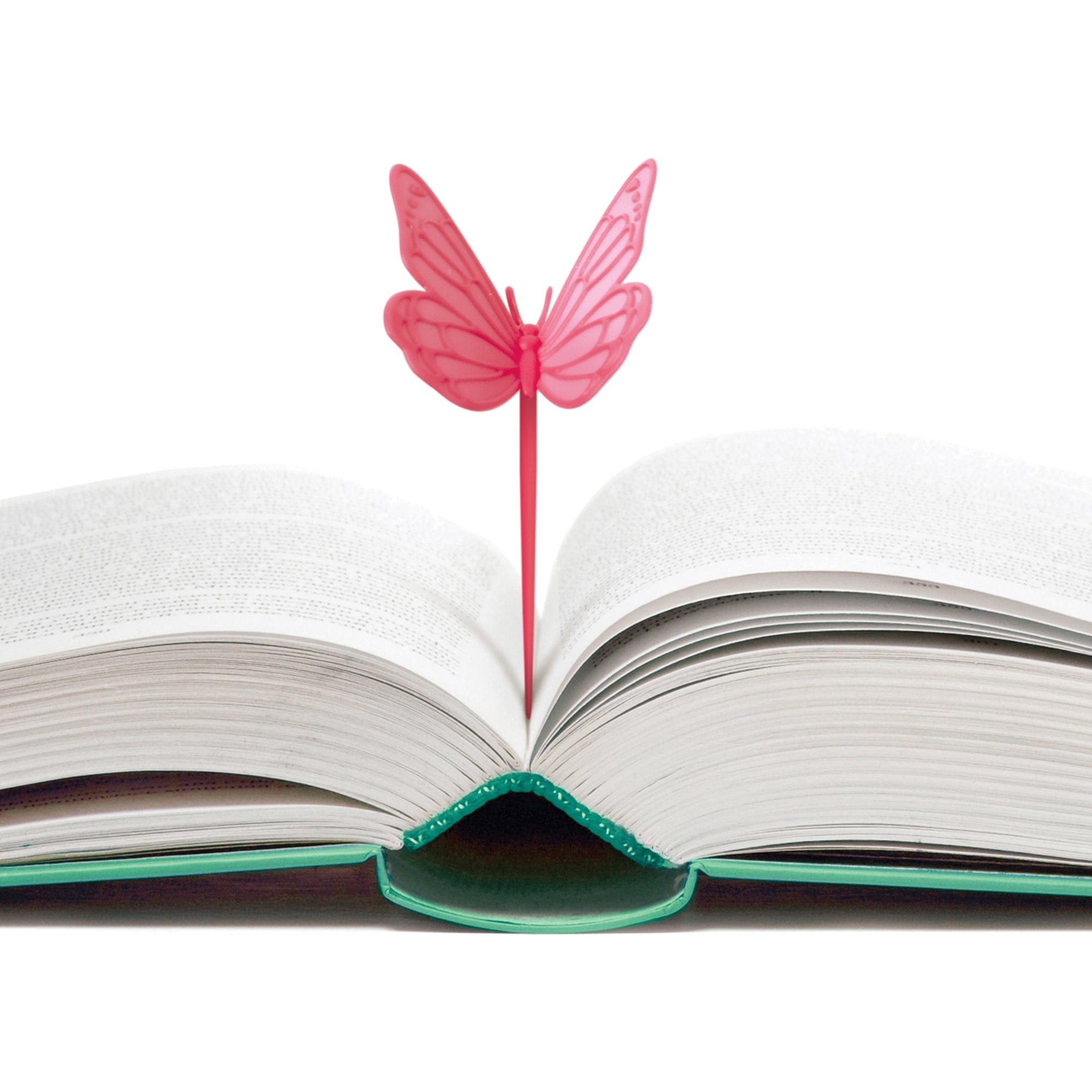 Pink butterfly-shaped bookmark on an open book with a white background
