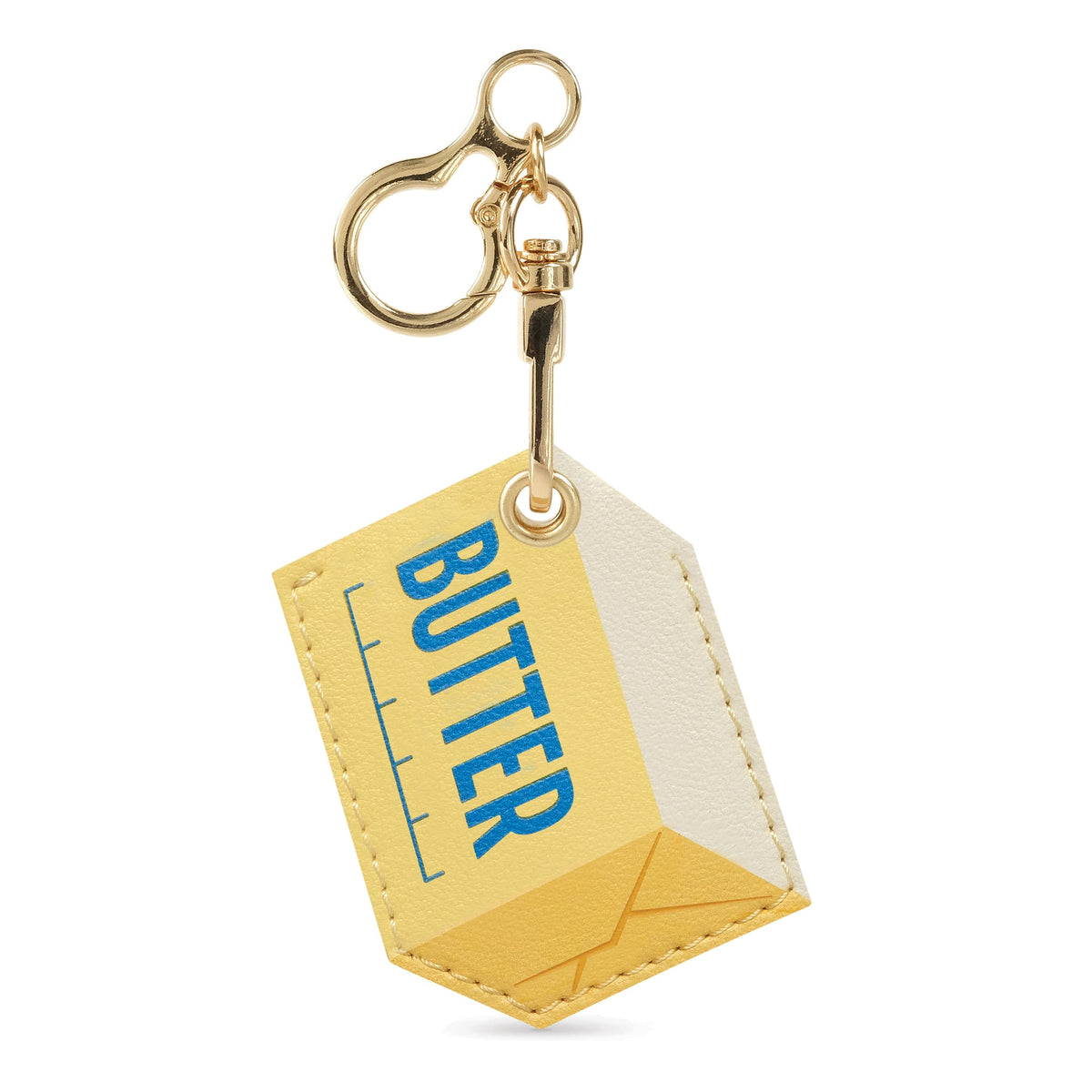 Gold tone keychain with circular ring and small clasp attached to a yellow tag reading BUTTER.
Yellow butter stick vegan leather bag charm on a gold keyring. A quirky holiday gift and easy stocking stuffer $10 and under.
