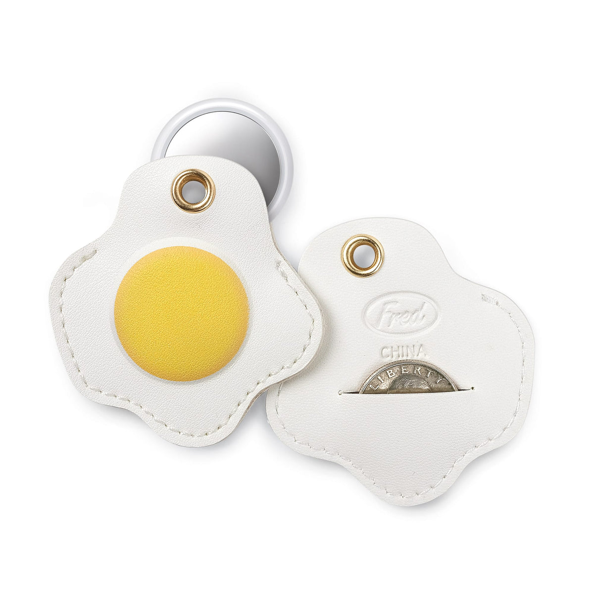 Close-up of the fried egg bag charm near a bag's coin pocket, demonstrating the hidden emergency quarter slot. A highly practical, functional holiday gift and top stocking stuffer under $10.